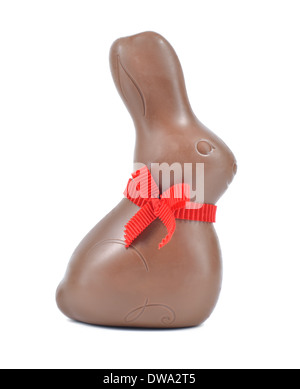 Chocolate Easter bunny or rabbit with red ribbon isolated on white background. Stock Photo