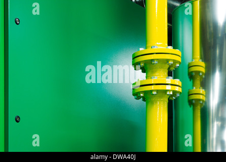 Plant room mechanical systems showing high pressure pipes bolted together using a flange system for added safety Stock Photo