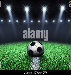 Soccer arena and ball with floodlights Stock Photo