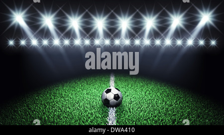 Soccer arena and ball with floodlights Stock Photo