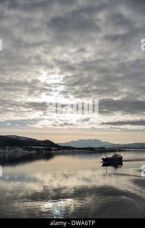 Fishing boat off the coast of Norway near Tromso Stock Photo