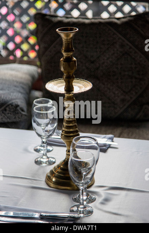 Close-up of candlestick holder with wineglasses on table, Medina, Marrakesh, Morocco Stock Photo