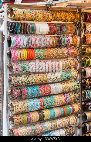 Traditional brightly coloured bangles for sale in shop in New Delhi, India Stock Photo