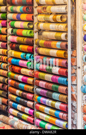 Display of traditional brightly coloured bangles for sale in shop in New Delhi, India Stock Photo