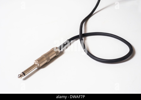 A close up of a guitar cable isolated on a white background Stock Photo