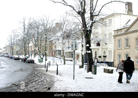 People walking in the snow in Witney Oxfordshire England. Stock Photo