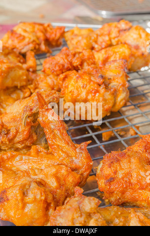 Hot fried chicken wings sale in the fresh food market at Rayong Thailand Stock Photo