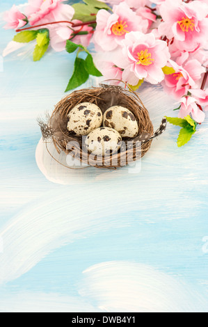 Easter decoration with flowers and eggs in nest Stock Photo