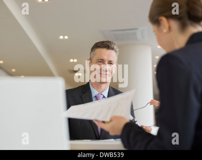 Business people working in office cafeteria Stock Photo