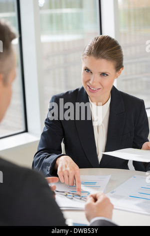 Businesswoman discussing with colleague at cafeteria Stock Photo