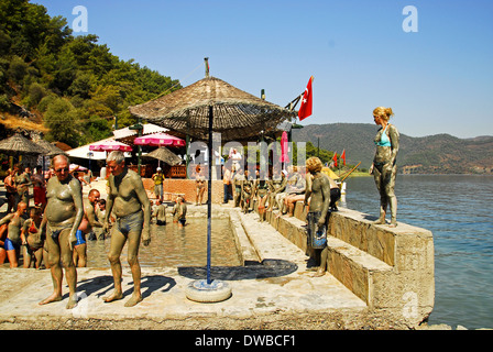 Tourists in The Ilica mud baths, upriver from Dalyan, Turkey. Stock Photo