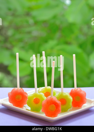 yellow and red watermelon lollipop Stock Photo