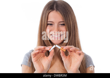 Beautiful woman with broken cigarette, stop smoking concept Stock Photo