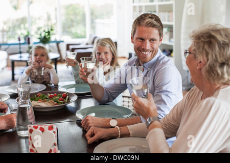 Happy family having lunch together at home Stock Photo