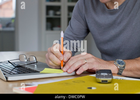 Close up of mature businessman working from home Stock Photo