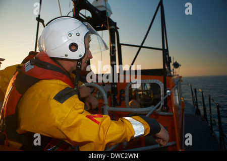 Lifeboat crew training on lifeboat at sea Stock Photo