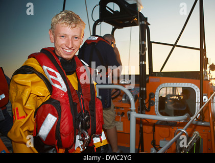 Portrait of young man crewing lifeboat at sea Stock Photo
