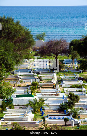 North Africa, Tunisia, Cape Bon, Hammamet. Woman in a Muslim cemetery. Stock Photo