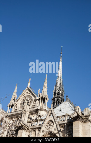 Detail of spires on the Notre-Dame de Paris, against a deep blue sky. Stock Photo