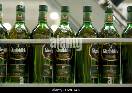 Bottles of Glenfiddich single malt whisky roll down the production line at the William Grant & Sons' bottling plant in Bellshill.
