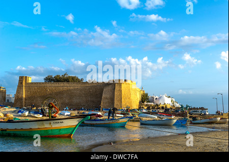 North Africa, Tunisia, Cap Bon, Hammamet, fisher boat front of fortification. Stock Photo