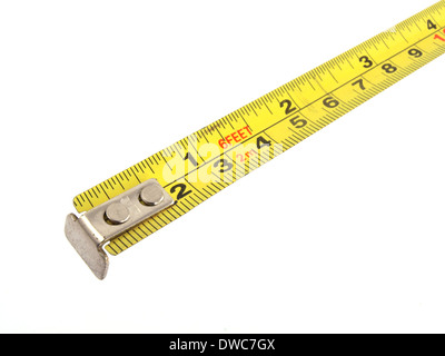 Close up photo of a yellow tape measure on a white background. Stock Photo