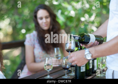 Young woman wine tasting at vineyard Stock Photo