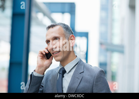 Businessman talking on smartphone Stock Photo