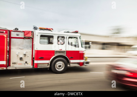 Blurred motion shot of speeding fire engine Stock Photo