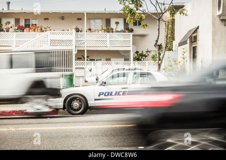 Blurred motion shot of speeding police car Stock Photo