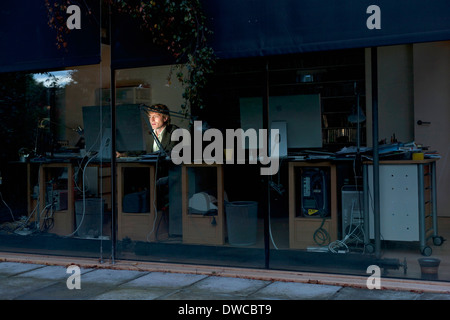 Young man at home working late on computer Stock Photo