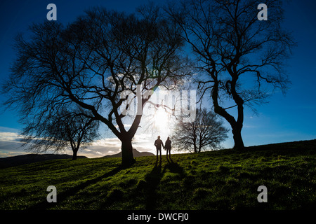 A young couple hold hands on Calton Hill in Edinburgh, capital of Scotland Stock Photo