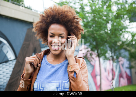 Young woman talking on smartphone Stock Photo