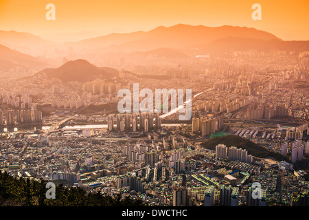 Busan, South Korea hazy sunset skyline. Stock Photo