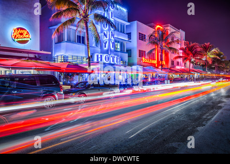 MIAMI, FLORIDA - JANUARY 6, 2014: Cars speed down Ocean Drive. The road is the main thoroughfare through South Beach. Stock Photo
