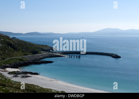 The ferry terminal on the Island of Eriskay, Western Isles, Scotland, UK. The Isle of Barra and the ferry in the distance. Stock Photo