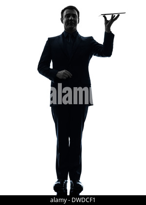 one  business man holding digital tablet in silhouette on white background Stock Photo