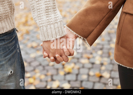 Couple holding hands during autumn Stock Photo