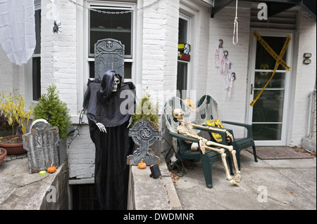 Spooky Halloween decorations in front of home, in the Kensington section of Brooklyn, NY, await Halloween trick-or-treaters. Stock Photo