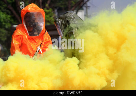 Quezon City, Philippines. 6th Mar, 2014. Soldiers from the Philippine Army wearing hazmat suits participate in the Chemical, Biological, Radiological, and Nuclear Explosive (CBRNE) capability demonstration at Camp Aguinaldo in Quezon City, the Philippines, March 6, 2014. Credit:  Rouelle Umali/Xinhua/Alamy Live News Stock Photo