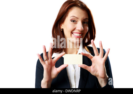 Smiling businesswoman showing blank business card isolated on white background Stock Photo