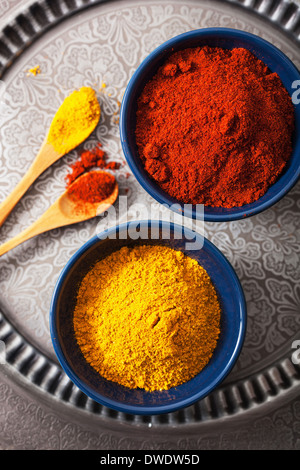 spices in bowls: curry and paprika powder Stock Photo