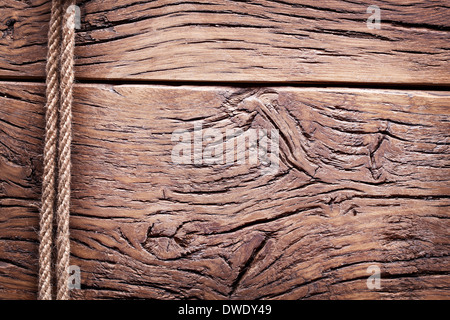 Rope over old wooden background. Stock Photo