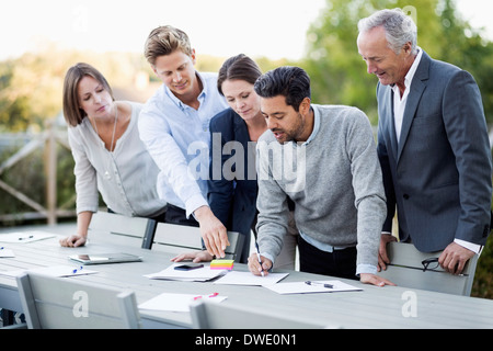 Business people discussing on patio Stock Photo