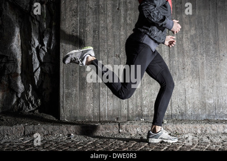 Full length of man running in tunnel Stock Photo