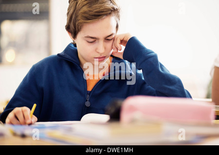 High school student studying in classroom Stock Photo