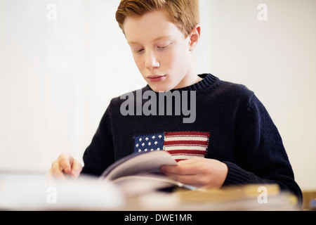 Reading Boy Inclass School boy reading in the classroom Stock Photo - Alamy