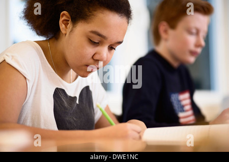 High school girl studying in class Stock Photo