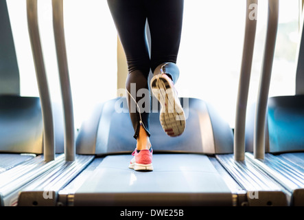 Low section of woman exercising on treadmill Stock Photo