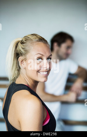 Side view portrait of smiling woman at gym Stock Photo